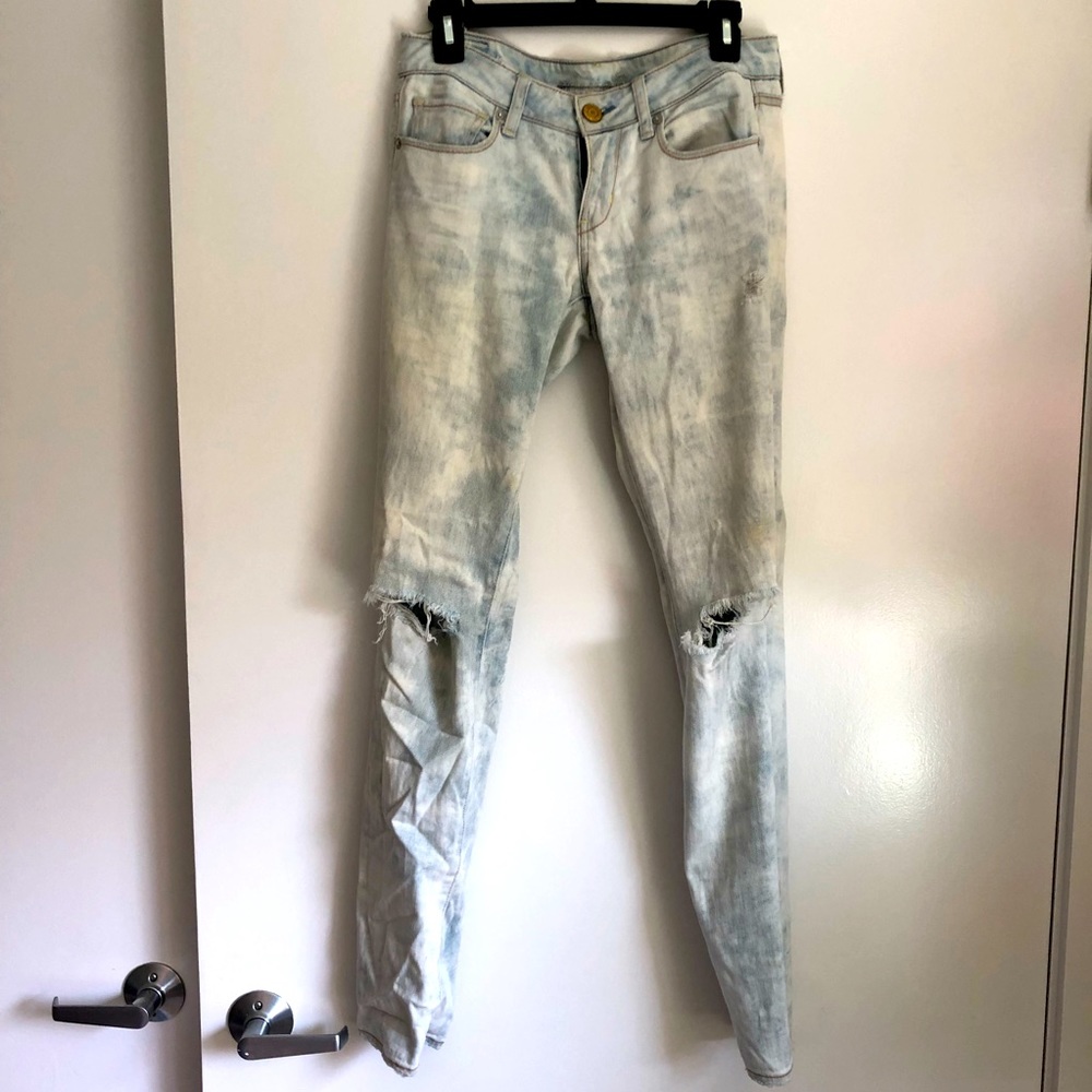 Distressed acid washed jeans